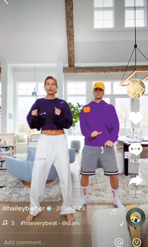 Enlargeable photo of a woman and a man dancing on Tik Tok