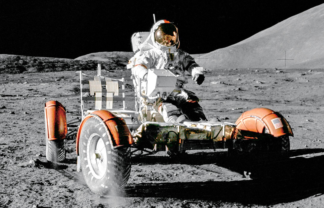 Image of an astronaut riding a moon rover on the moon