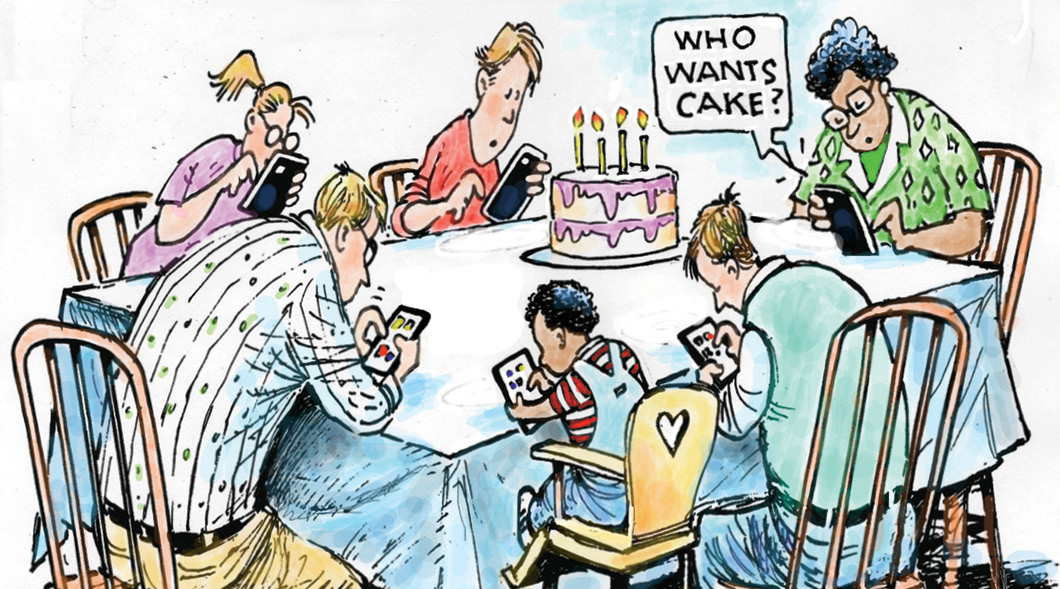 Comic of family gathered at table with their phones and one asking, "Who wants cake?"