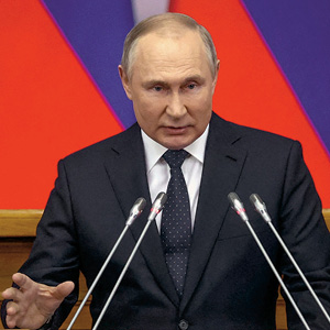 Russian President Vladimir Putin giving a speech in front of a podium