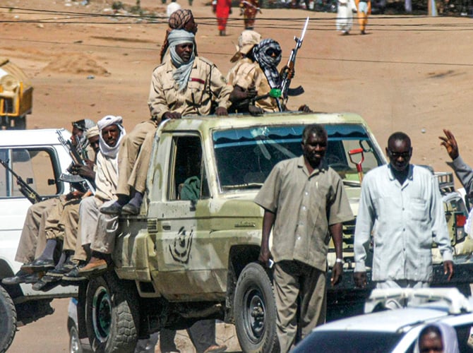 People with guns gathered in a truck