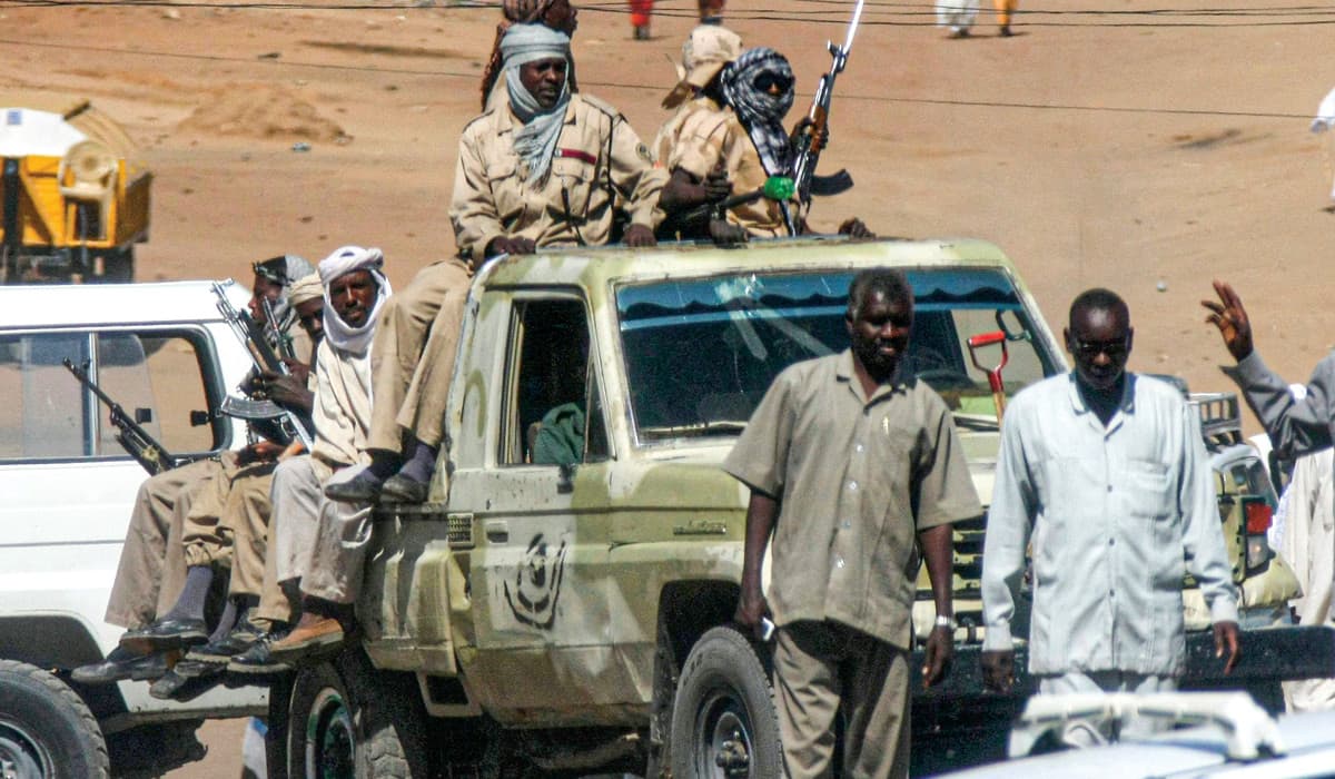 People with guns gathered in a truck