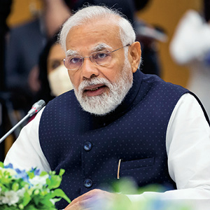 Photo of India&apos;s Prime Minister speaking into a microphone