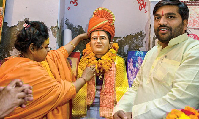 Photo of Hindu Nationalists honoring a statue