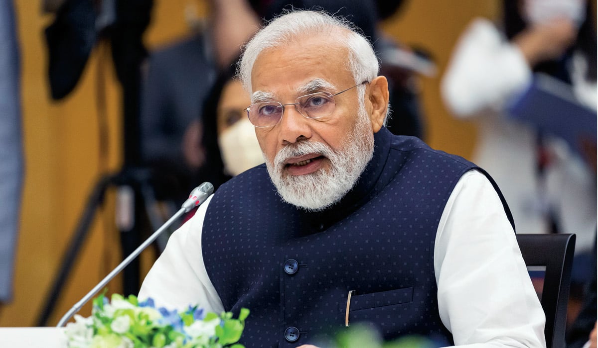 Photo of India&apos;s Prime Minister speaking into a microphone