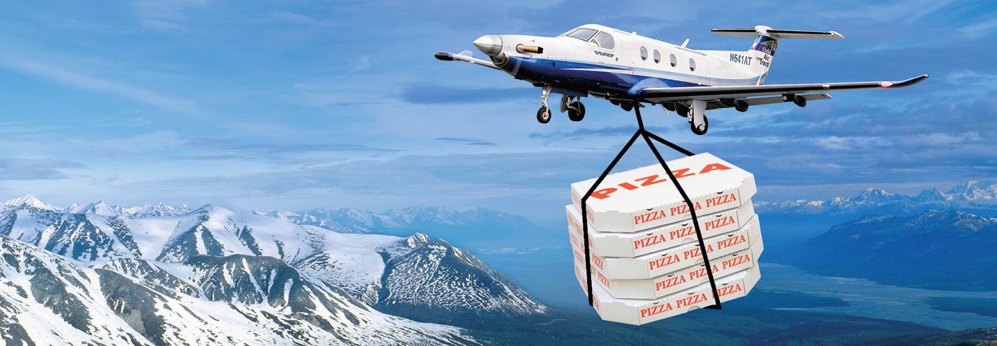 Image of a helicopter delivering boxes of pizza over mountaintops