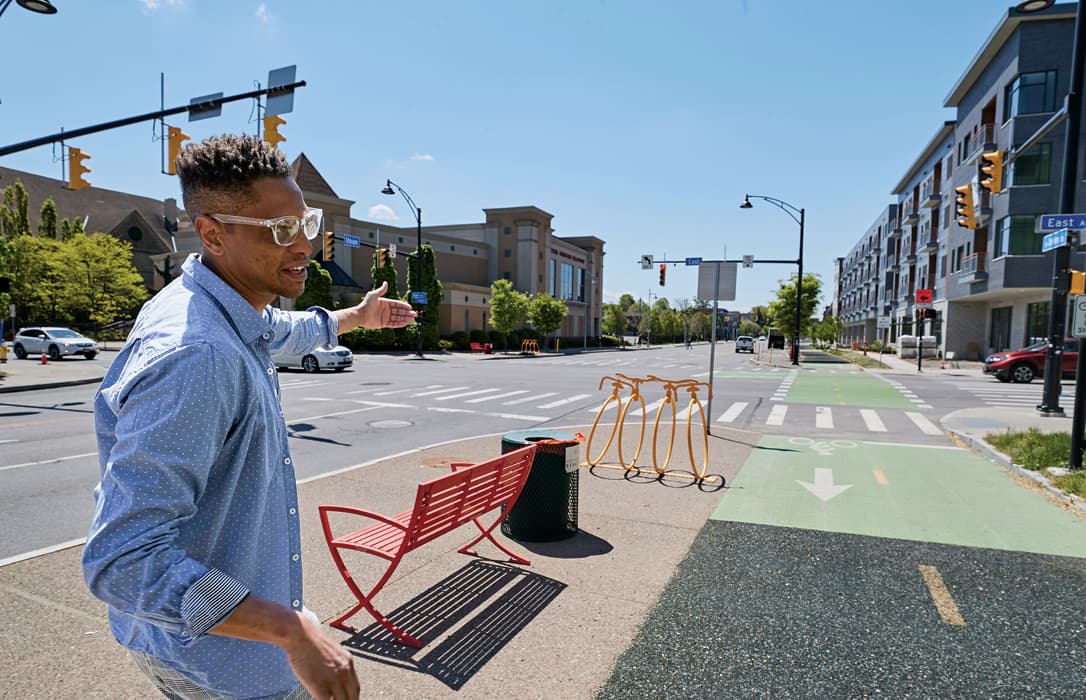 Photo of a person showing the bike lines in a city