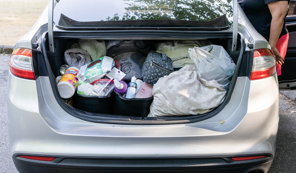 Photo of a car trunk filled with a person&apos;s belongings