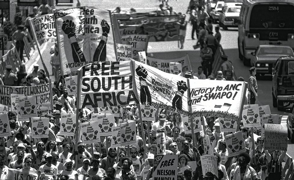 Black & white photo of people protesting for the freedom of South Africa