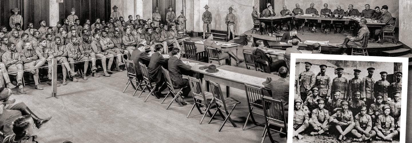Black & white photo of a trial for a large group of soldiers