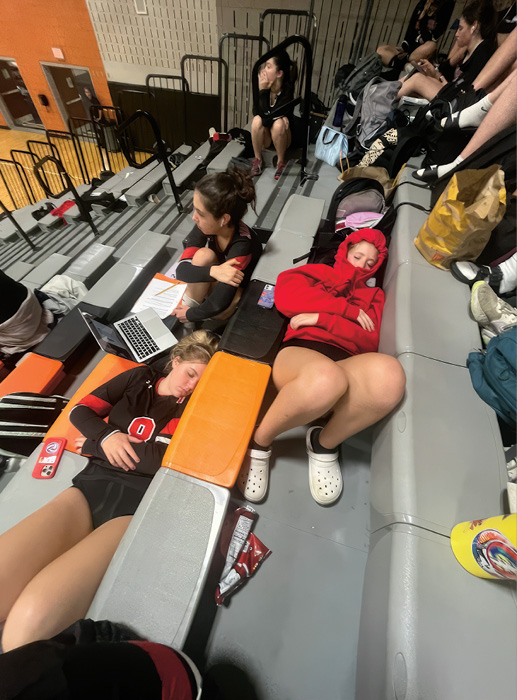 Photo of students sleeping in bleachers at school
