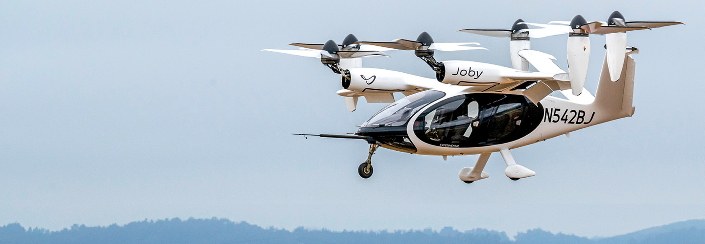 Image of a modern day air taxi resembling a helicopter