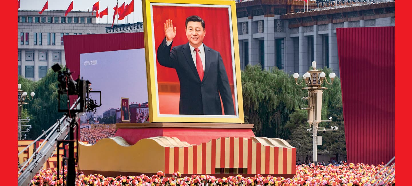 Image of people gathered around a huge portrait of the President of the People&apos;s Republic of China