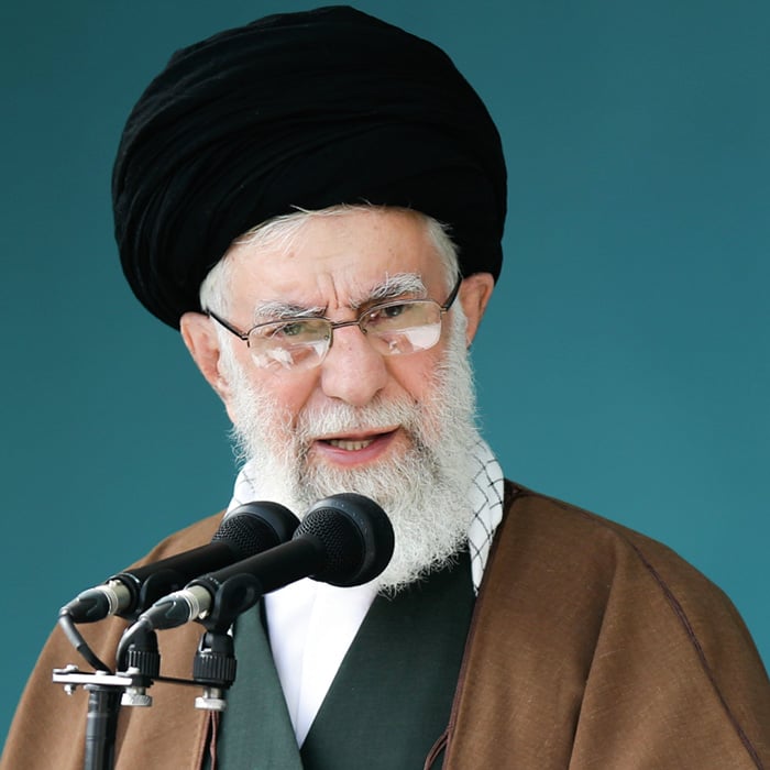 Photo of Iran&apos;s President Ebrahim Raisi speaking into a microphone