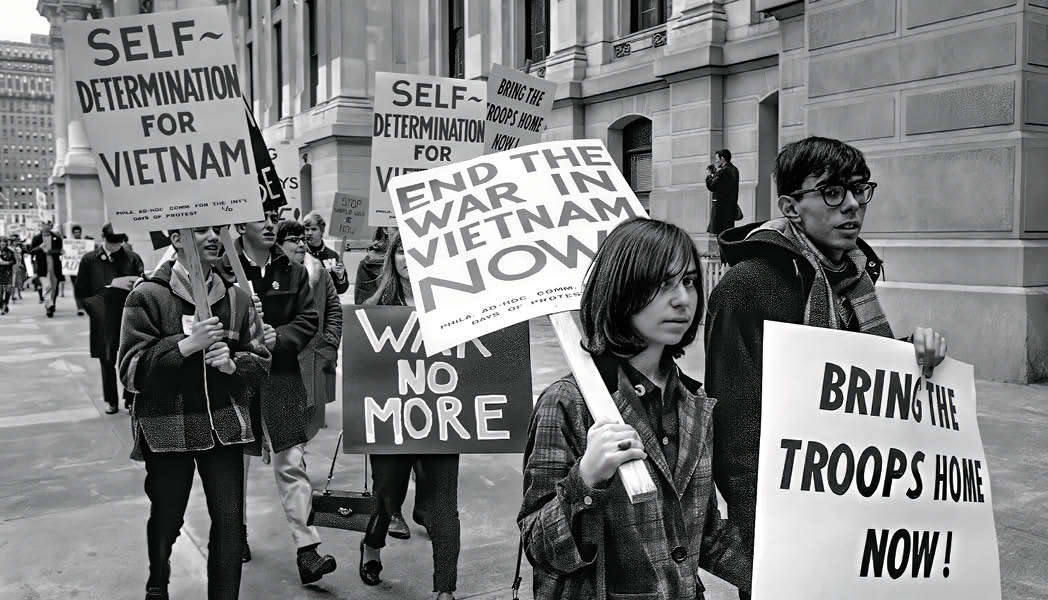 Black & white photo of American protestors with signs wanting the war in Vietnam to end