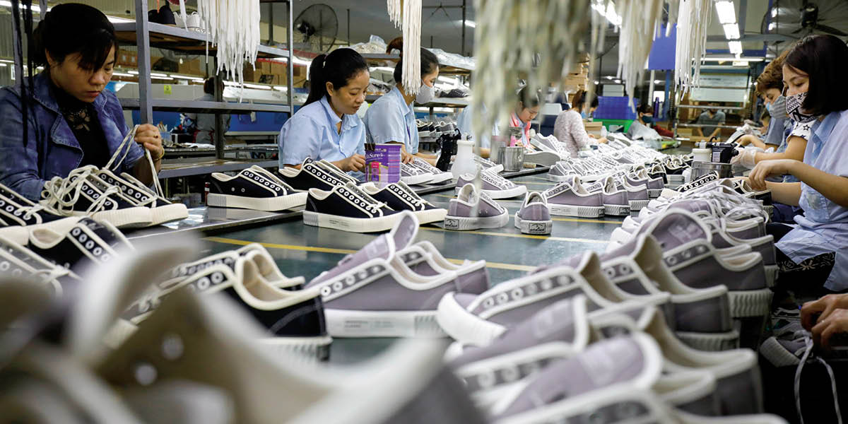 Photo of a shoe factory in Vietnam with many workers
